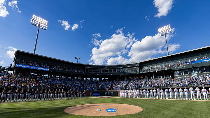 Jun 7, 2024; Chapel Hill, NC, USA; The North Carolina Tar Heels and West Virginia Mountaineers stand for the playing of the national anthem prior to the DI Baseball Super Regional at Boshamer Stadium.  Mandatory Credit: Jeffrey Camarati-Imagn Images
