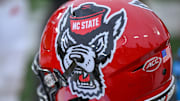 Nov 11, 2023; Winston-Salem, North Carolina, USA; The North Carolina State Wolfpack helmet rests on the bench during the second half against the Wake Forest Demon Deacons at Allegacy Federal Credit Union Stadium. Mandatory Credit: William Howard-Imagn Images