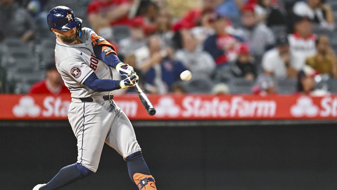 Sep 27, 2025; Anaheim, California, USA; Houston Astros first baseman Christian Walker (8) hits a solo home run against the Los Angeles Angels during the ninth inning at Angel Stadium. Sep 27, 2025; Anaheim, California, USA; Houston Astros first baseman Christian Walker (8) hits a solo home run against the Los Angeles Angels during the ninth inning at Angel Stadium.