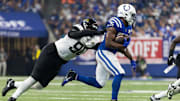 Sep 10, 2023; Indianapolis, Indiana, USA; Indianapolis Colts running back Deon Jackson (35) runs the ball while Jacksonville Jaguars defensive end Angelo Blackson (90) defends in the second half at Lucas Oil Stadium. Mandatory Credit: Trevor Ruszkowski-Imagn Images