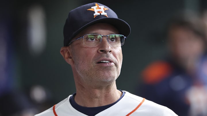 Apr 14, 2026; Houston, Texas, USA; Houston Astros manager Joe Espada looks on from the dugout before the game against the Colorado Rockies at Daikin Park. Mandatory Credit: Troy Taormina-Imagn Images