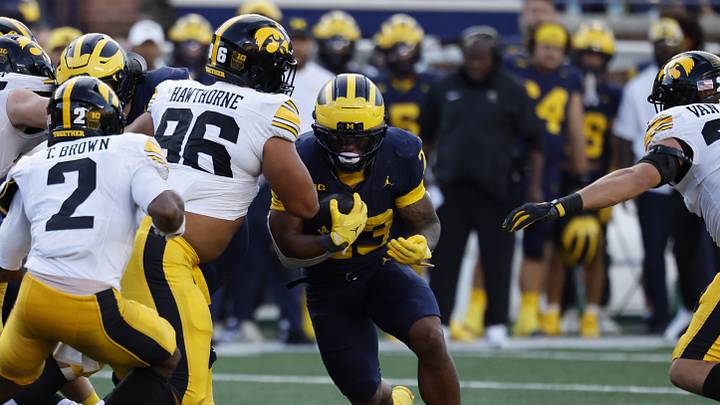 Sep 26, 2026; Ann Arbor, Michigan, USA;  Michigan Wolverines running back Jordan Marshall (23) runs against Iowa Hawkeyes defensive line Bryce Hawthorne (96) during the second half at Michigan Stadium.  Mandatory Credit: Rick Osentoski-Imagn Images
