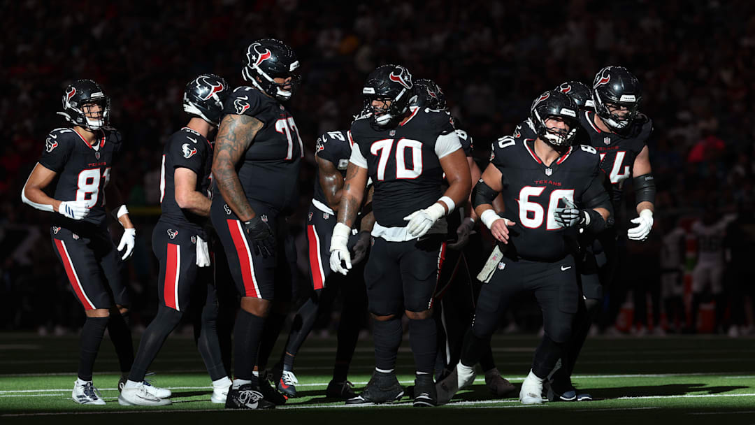 Nov 9, 2025; Houston, Texas, USA; Houston Texans center Juice Scruggs (70) and the offensive line break from a huddle against the Jacksonville Jaguars in the fourth quarter at NRG Stadium. Mandatory Credit: Thomas Shea-Imagn Images