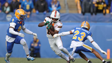 Nov 29, 2025; Pittsburgh, Pennsylvania, USA;  Miami Hurricanes wide receiver Malachi Toney (10) runs after a catch as Pittsburgh Panthers linebacker Kyle Louis (9) and safety Kavir Bains-Marquez (23) chase during the first quarter at Acrisure Stadium. Mandatory Credit: Charles LeClaire-Imagn Images
