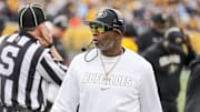 Nov 8, 2025; Morgantown, West Virginia, USA; Colorado Buffaloes head coach Deion Sanders walks along the sidelines late in the fourth quarter against the West Virginia Mountaineers at Milan Puskar Stadium. Mandatory Credit: Ben Queen-Imagn Images