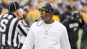 Nov 8, 2025; Morgantown, West Virginia, USA; Colorado Buffaloes head coach Deion Sanders walks along the sidelines late in the fourth quarter against the West Virginia Mountaineers at Milan Puskar Stadium. Mandatory Credit: Ben Queen-Imagn Images