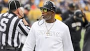 Nov 8, 2025; Morgantown, West Virginia, USA; Colorado Buffaloes head coach Deion Sanders walks along the sidelines late in the fourth quarter against the West Virginia Mountaineers at Milan Puskar Stadium. Mandatory Credit: Ben Queen-Imagn Images