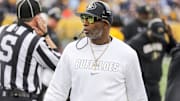 Nov 8, 2025; Morgantown, West Virginia, USA; Colorado Buffaloes head coach Deion Sanders walks along the sidelines late in the fourth quarter against the West Virginia Mountaineers at Milan Puskar Stadium. Mandatory Credit: Ben Queen-Imagn Images