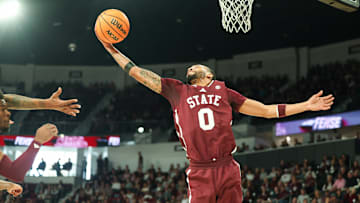 Mar 1, 2025; Starkville, Mississippi, USA; Mississippi State Bulldogs guard Claudell Harris Jr. (0) grabs a rebound against the LSU Tigers during the first half at Humphrey Coliseum. Mandatory Credit: Wesley Hale-Imagn Images