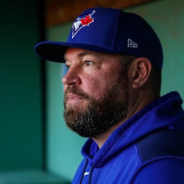 Apr 9, 2025; Boston, Massachusetts, USA; Toronto Blue Jays manager John Schneider (14) talks with reporters before the start of the game against the Boston Red Sox at Fenway Park. 