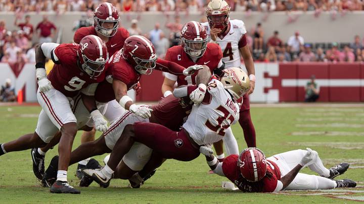 Sep 19, 2026; Tuscaloosa, AL, USA;  Alabama defenders gang tackle Florida State running back Ousmane Kromah (32) at Bryant-Denny Stadium. Alabama defeated Florida State 50-36. Mandatory Credit: Gary Cosby Jr.-Tuscaloosa News