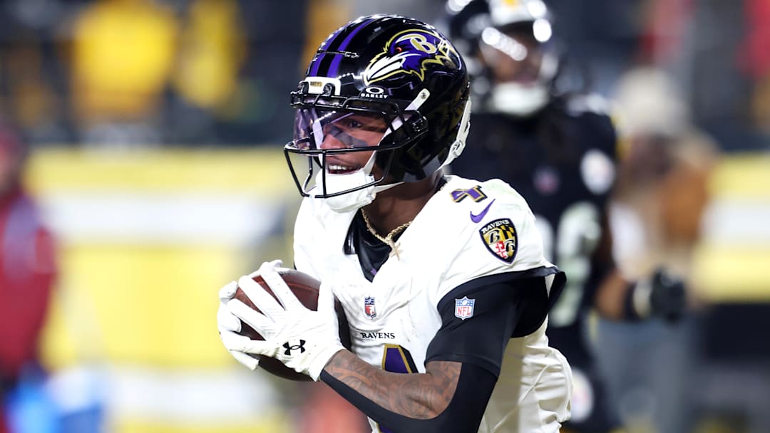 Jan 4, 2026; Pittsburgh, Pennsylvania, USA; Baltimore Ravens wide receiver Zay Flowers (4) makes a touchdown catch against the Pittsburgh Steelers during the second half at Acrisure Stadium. Mandatory Credit: Charles LeClaire-Imagn Images