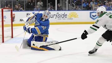Jan 25, 2025; St. Louis, Missouri, USA; St. Louis Blues goaltender Jordan Binnington (50) defends the net from Dallas Stars center Mavrik Bourque (22) during the third period at Enterprise Center. Mandatory Credit: Jeff Le-Imagn Images