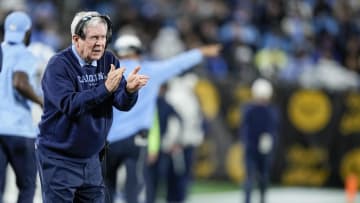 Dec 27, 2023; Charlotte, NC, USA; North Carolina Tar Heels head coach Mack Brown tries to cheer on his defense during the second half against the West Virginia Mountaineers at Bank of America Stadium. Mandatory Credit: Jim Dedmon-USA TODAY Sports