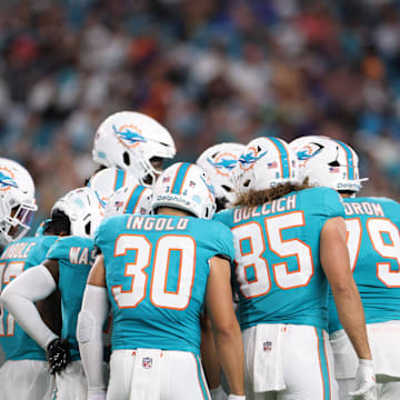 The Miami Dolphins huddle during the second quarter against the Baltimore Ravens at Hard Rock Stadium. Mandatory Credit: Nathan Ray Seebeck-Imagn Images