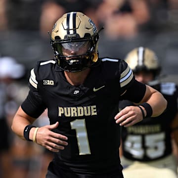 Aug 31, 2024; West Lafayette, Indiana, USA; Purdue Boilermakers quarterback Hudson Card (1) warms up before the game against the Indiana State Sycamores at Ross-Ade Stadium. Mandatory Credit: Marc Lebryk-Imagn Images