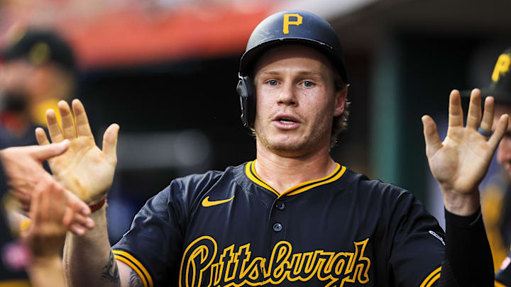Sep 23, 2025; Cincinnati, Ohio, USA; Pittsburgh Pirates outfielder Jack Suwinski (65) high fives teammates after scoring on a RBI single hit by second baseman Nick Yorke (not pictured) in the second inning against the Cincinnati Reds at Great American Ball Park. Mandatory Credit: Katie Stratman-Imagn Images