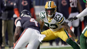 Green Bay Packers cornerback Jaire Alexander (23) tackles Chicago Bears running back D'Andre Swift in what would be hist last game with the team.