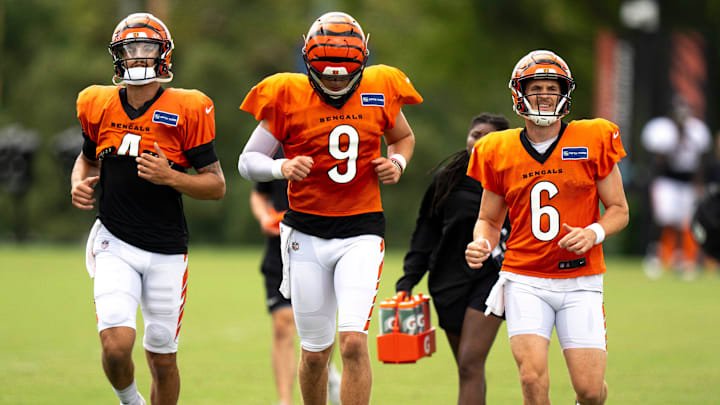 Cincinnati Bengals quarterback Desmond Ridder (4), Cincinnati Bengals quarterback Joe Burrow (9) and Cincinnati Bengals quarterback Jake Browning (6) run together during Cincinnati Bengals Practice in Cincinnati on Aug. 21, 2025.