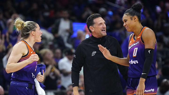 Phoenix Mercury head coach Nate Tibbetts celebrates with forward Satou Sabally (0) and Sami Whitcomb (33) during the Mercury home opener against the Seattle Storm in the PHX Arena in Phoenix on May 17, 2025.