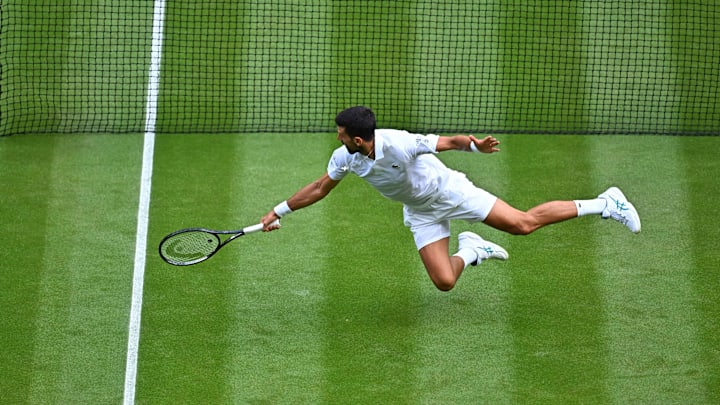 Novak Djokovic create a classic highlight during his match against Miomir Kecmanović at WImbledon. Novak Djokovic create a classic highlight during his match against Miomir Kecmanović at WImbledon.