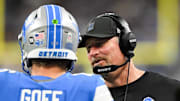 Detroit Lions head coach Dan Campbell speaks with quarterback Jared Goff (16) in the third quarter against the Vikings