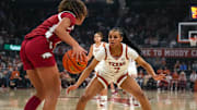 Texas Longhorns guard Jordan Lee (7) guards Arkansas guard Phoenix Stotijn (1) during the game at the Moody Center on Sunday, Jan. 5, 2025.