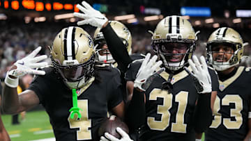 Oct 5, 2025; New Orleans, Louisiana, USA; New Orleans Saints cornerback Kool-Aid McKinstry (4) and New Orleans Saints safety Jordan Howden (31) celebrate after an interception against the New York Giants during the fourth quarter at Caesars Superdome. Mandatory Credit: Matthew Hinton-Imagn Images