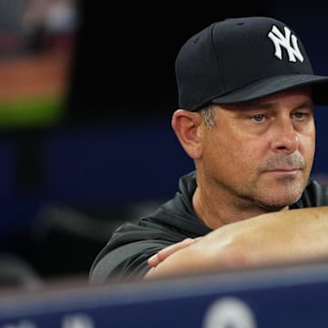 Jul 1, 2025; Toronto, Ontario, CAN; New York Yankees manager Aaron Boone (17) watches batting practice before a game against the Toronto Blue Jays at Rogers Centre. Mandatory Credit: Nick Turchiaro-Imagn Images