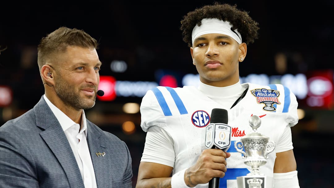Jan 1, 2026; New Orleans, LA, USA; ESPN broadcaster Tim Tebow interviews Mississippi Rebels quarterback Trinidad Chambliss (6) after the 2026 Sugar Bowl and quarterfinal game of the College Football Playoff against the Georgia Bulldogs at Caesars Superdome. Mandatory Credit: Amber Searls-Imagn Images