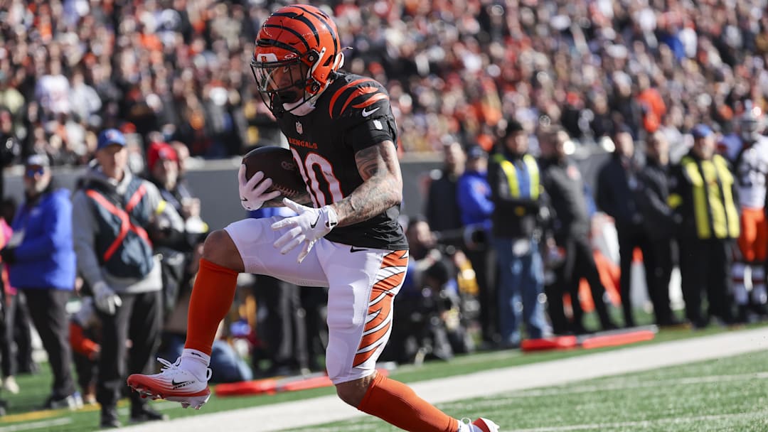 Jan 4, 2026; Cincinnati, Ohio, USA; Cincinnati Bengals running back Chase Brown (30) scores a touchdown after catching a pass against the Cleveland Browns during the first quarter at Paycor Stadium. Mandatory Credit: Joseph Maiorana-Imagn Images