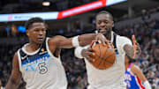 Nov 27, 2024; Minneapolis, Minnesota, USA; Minnesota Timberwolves guard Anthony Edwards (5) and forward Julius Randle (30) chase a loose ball against the Sacramento Kings in the second quarter at Target Center. Mandatory Credit: Brad Rempel-Imagn Images