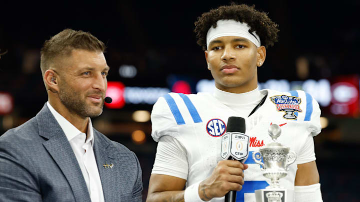 Jan 1, 2026; New Orleans, LA, USA; ESPN broadcaster Tim Tebow interviews Mississippi Rebels quarterback Trinidad Chambliss (6) after the 2026 Sugar Bowl and quarterfinal game of the College Football Playoff against the Georgia Bulldogs at Caesars Superdome. Mandatory Credit: Amber Searls-Imagn Images