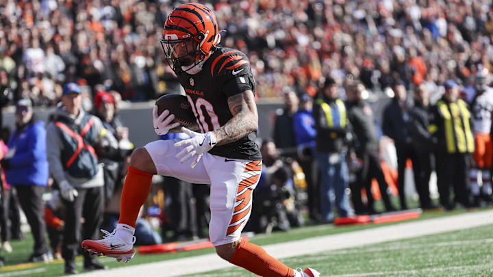 Jan 4, 2026; Cincinnati, Ohio, USA; Cincinnati Bengals running back Chase Brown (30) scores a touchdown after catching a pass against the Cleveland Browns during the first quarter at Paycor Stadium. Mandatory Credit: Joseph Maiorana-Imagn Images