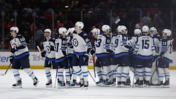 Feb 1, 2025; Washington, District of Columbia, USA; Winnipeg Jets players celebrate after their overtime game against the Washington Capitals at Capital One Arena. Mandatory Credit: Geoff Burke-Imagn Images