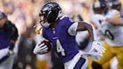 Dec 7, 2025; Baltimore, Maryland, USA; Baltimore Ravens quarterback Lamar Jackson (8) runs with the ball against the Pittsburgh Steelers during the first half at M&T Bank Stadium. Mandatory Credit: Peter Casey-Imagn Images