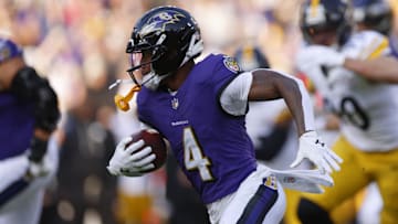 Dec 7, 2025; Baltimore, Maryland, USA; Baltimore Ravens quarterback Lamar Jackson (8) runs with the ball against the Pittsburgh Steelers during the first half at M&T Bank Stadium. Mandatory Credit: Peter Casey-Imagn Images