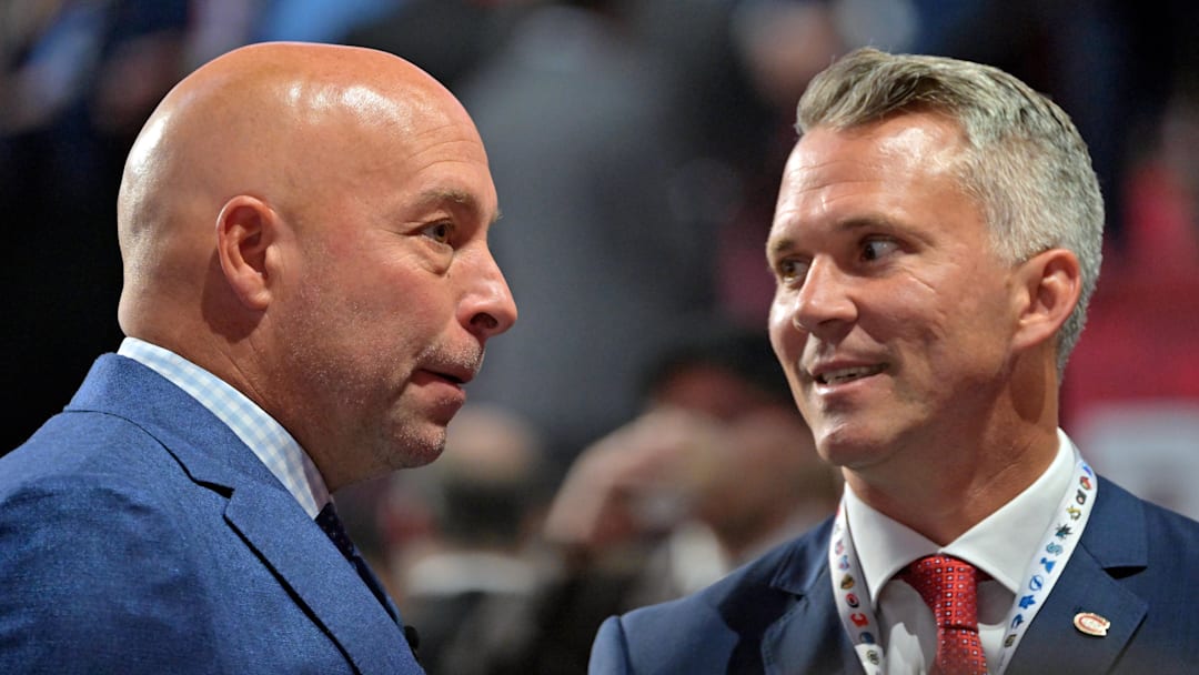Jul 7, 2022; Montreal, Quebec, CANADA; Montreal Canadiens general manager Kent Hughes (left) talks with head coach Martin St. Louis before the first round of the 2022 NHL Draft at Bell Centre. Mandatory Credit: Eric Bolte-Imagn Images
