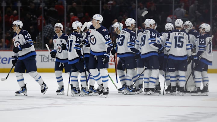 Feb 1, 2025; Washington, District of Columbia, USA; Winnipeg Jets players celebrate after their overtime game against the Washington Capitals at Capital One Arena. Mandatory Credit: Geoff Burke-Imagn Images