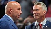 Jul 7, 2022; Montreal, Quebec, CANADA; Montreal Canadiens general manager Kent Hughes (left) talks with head coach Martin St. Louis before the first round of the 2022 NHL Draft at Bell Centre. Mandatory Credit: Eric Bolte-Imagn Images