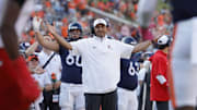 Oct 12, 2024; Charlottesville, Virginia, USA; Virginia Cavaliers head coach Tony Elliott reacts after a play against the Louisville Cardinals during the first half at Scott Stadium. Mandatory Credit: Amber Searls-Imagn Images