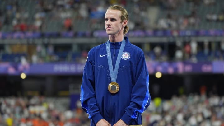 Aug 6, 2024; Paris Saint-Denis, France; Cole Hocker (USA) celebrates his gold medal in the men's 1500m during the Paris 2024 Olympic Summer Games at Stade de France. Mandatory Credit: Andrew Nelles-USA TODAY Sports