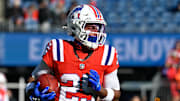 Dec 1, 2024; Foxborough, Massachusetts, USA; New England Patriots cornerback Marcus Jones (25) warms up before a game against the Indianapolis Colts at Gillette Stadium. Mandatory Credit: Eric Canha-Imagn Images