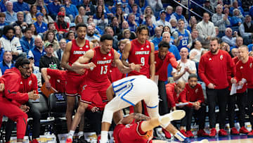 Kentucky Wildcats forward Brandon Garrison (10) fights for the jump ball against Louisville Cardinals forward James Scott (0) during their game on Saturday, Dec. 14, 2024 at Rupp Arena in Lexington, Ky.