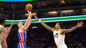 Nov 16, 2024; Sacramento, California, USA; Sacramento Kings guard Kevin Huerter (9) shoots against Utah Jazz forward John Collins (20) during the second quarter at Golden 1 Center. Mandatory Credit: Darren Yamashita-Imagn Images