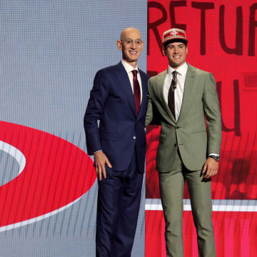 Jun 26, 2024; Brooklyn, NY, USA; Reed Sheppard poses for photos with NBA commissioner Adam Silver after being selected third overall by the Houston Rockets in the first round of the 2024 NBA Draft at Barclays Center. Mandatory Credit: Brad Penner-USA TODAY Sports