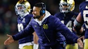 Notre Dame head coach Marcus Freeman celebrates a touchdown scored during the first round of the College Football Playoff between Notre Dame and Indiana.