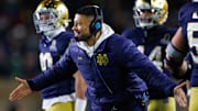 Notre Dame head coach Marcus Freeman celebrates a touchdown scored during the first round of the College Football Playoff between Notre Dame and Indiana.