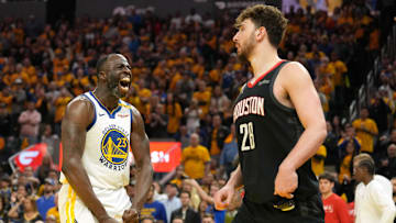 Apr 26, 2025; San Francisco, California, USA; Golden State Warriors forward Draymond Green (23) reacts after forcing a turnover by Houston Rockets center Alperen Sengun (28) during the fourth quarter of game three of first round for the 2024 NBA Playoffs at Chase Center. Mandatory Credit: Darren Yamashita-Imagn Images