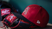 A general view of an Arizona Diamondbacks hat and Rawlings glove in the dugout during the fifth inning of the game against the Washington Nationals at Nationals Park in 2023.